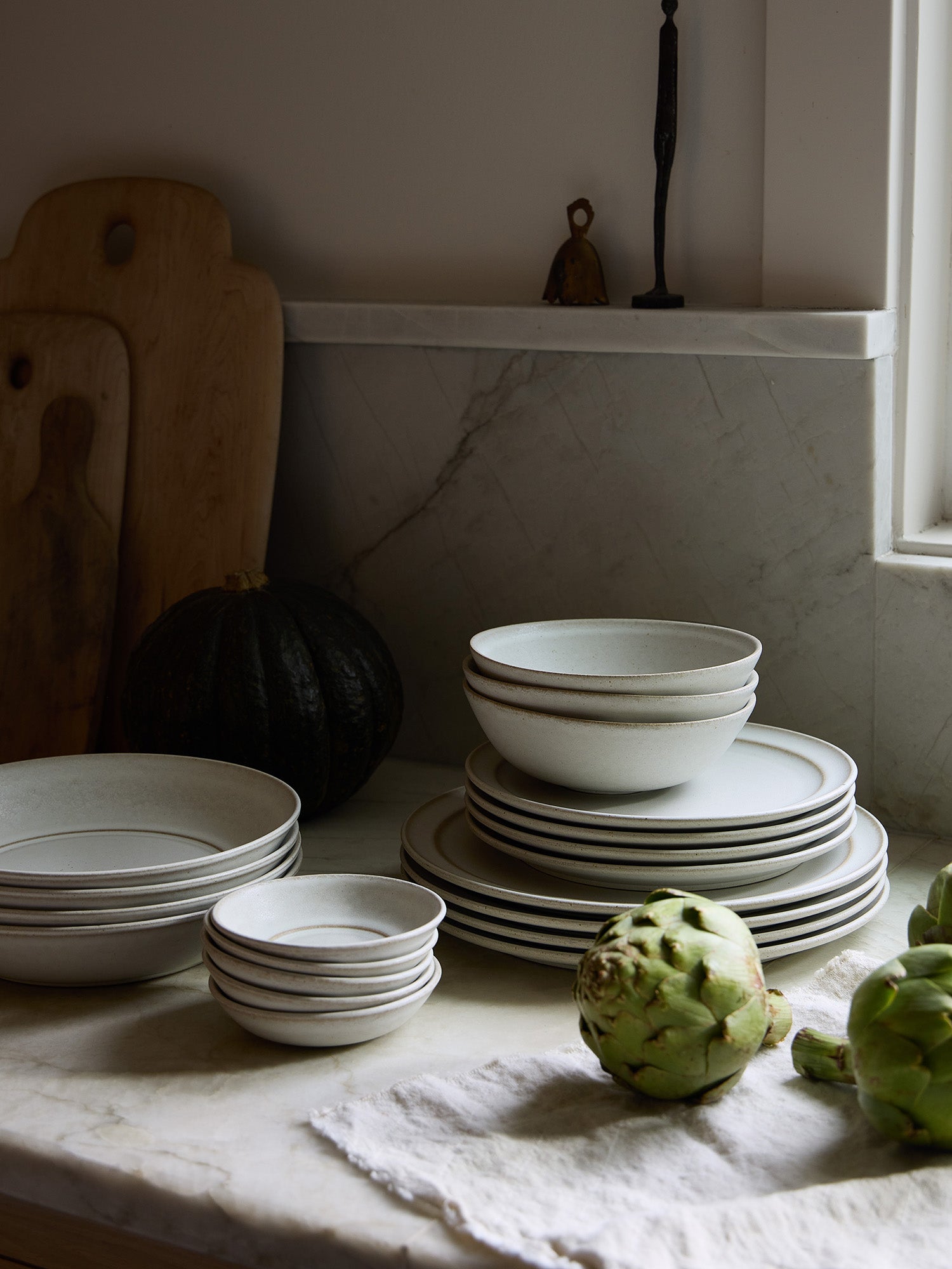 Complete Standard Affair dinnerware collection on a marble kitchen countertop