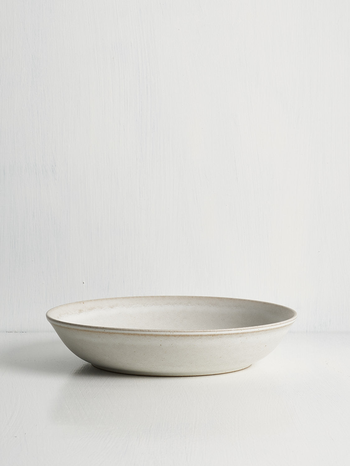 Elegant white ceramic bowl designed for pasta, grains, braises, curries, or shared dishes