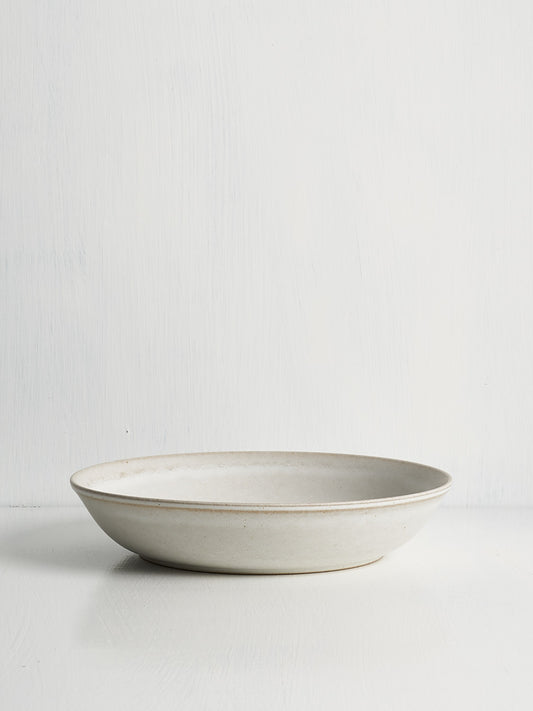 Elegant white ceramic bowl designed for pasta, grains, braises, curries, or shared dishes