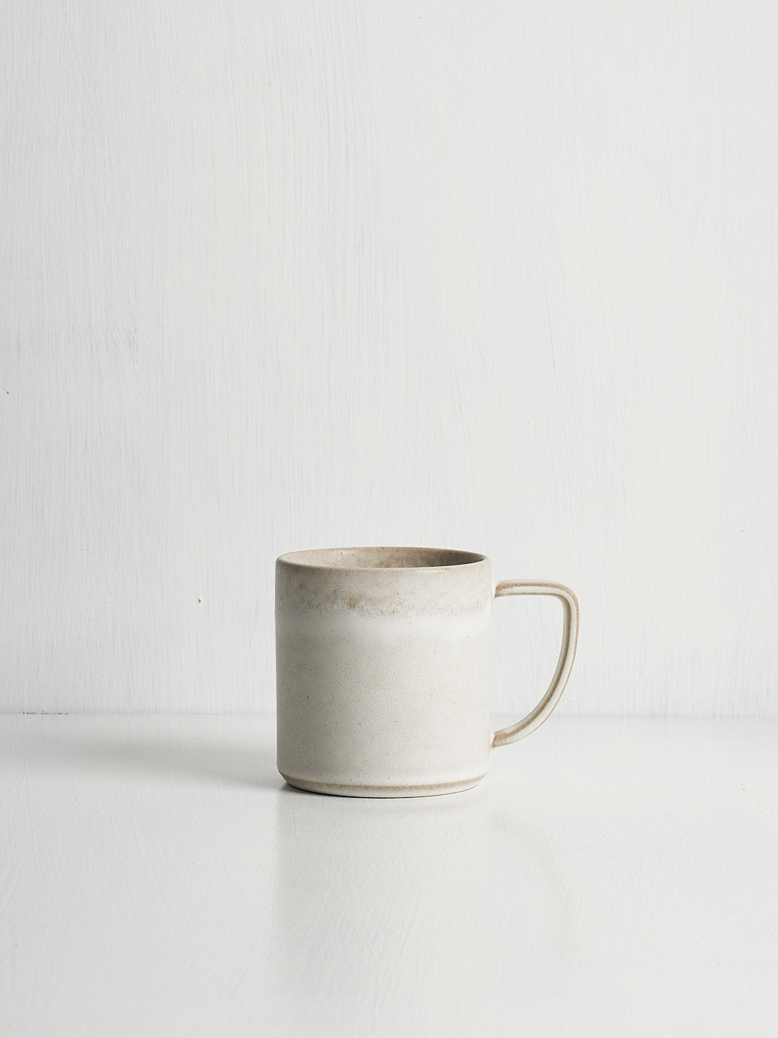 High end white stoneware mug made in Portugal with relaxed, timeless design
